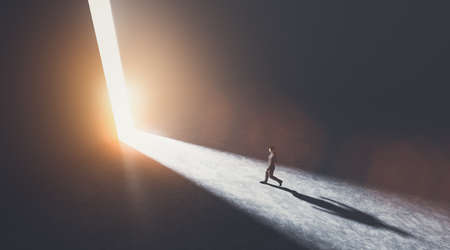 Businessman walking towards an open big gate of light. Concept of hope, new better world, bright future. 3D illustrationの写真素材