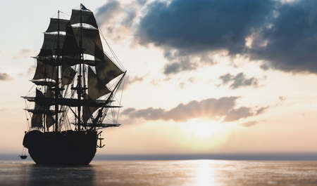 Pirate ship sailing on the ocean at sunset. Vintage cruiseの写真素材