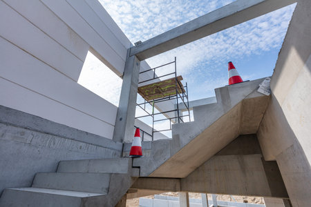 Warehouse stairs construction. Building a new industrial hall or storehouse