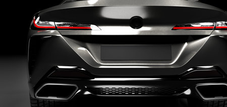 Rear detail shot of modern black premium car in studio light. Brandless modern style. 3D...