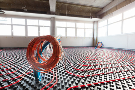 Floor heating and electrical outputs in a new building. Interior design and finishing industry. Office and apartmentの写真素材
