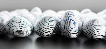 Elegant painted white Easter eggs with blue shiny stripes. Modern decoration, greeting cardの写真素材