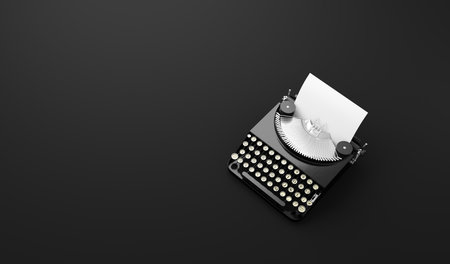 Retro vintage typewriter with blank piece of paper in monochromeの写真素材