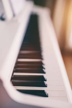 Classic white piano keyboard close-upの写真素材