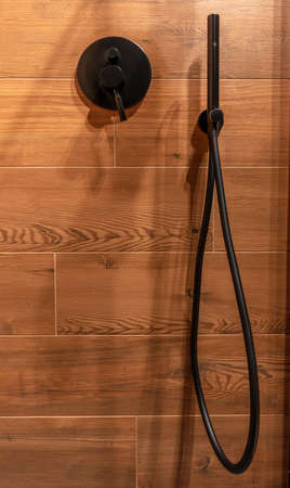 Black shower faucet in modern bathroomの写真素材