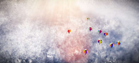 Hot air balloons flying above clouds. Adventure and travelの写真素材