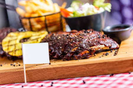 Ribs with salad and french fries served in an american restaurantの写真素材
