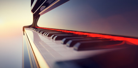 Grand piano keyboard on sunset sky background. Music and entertainmentの写真素材