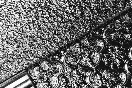 Decorative glass plates background. Black glassy decor close-upの写真素材