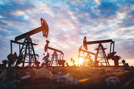 Oil pump jack work on oilfield. Drill and petroleum extractionの写真素材