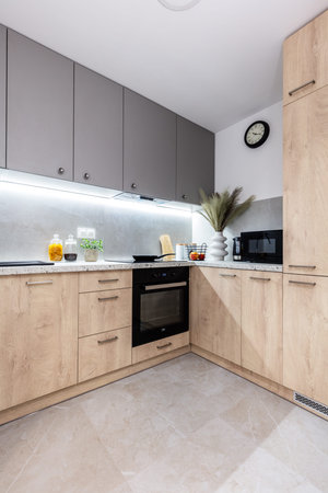 Fitted kitchen in small new apartment, interior design