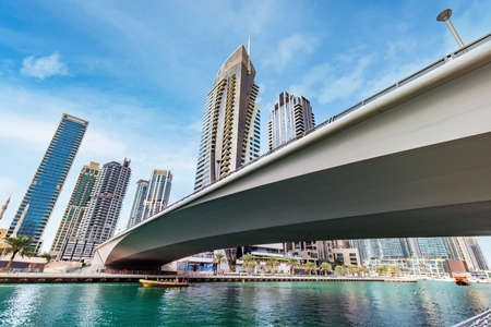 Bridge over Dubai marina in UAE. High-rise residential buildings, business skyscrapersのeditorial素材