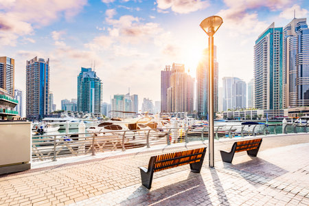 Dubai marina promenade in UAE at sunset. High-rise residential buildings, business skyscrapersのeditorial素材