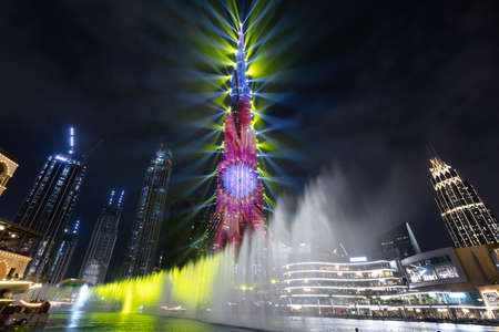 Burj Khalifa illumination with fountain show in Dubai UAE downtown at night. Modern tourist and business destinationのeditorial素材