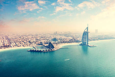Burj Al Arab hotel in Dubai UAE aerial view from helicopter at sunsetのeditorial素材