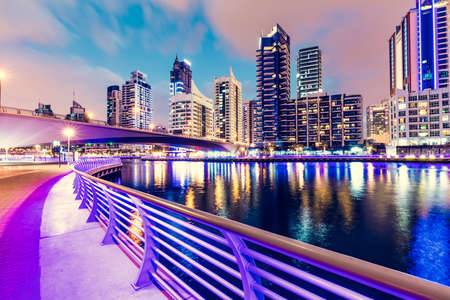 Dubai marina promenade in UAE at night. Highrise residential buildings, business skyscrapersのeditorial素材