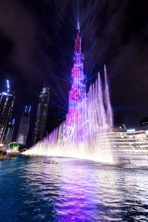 Burj Khalifa illumination with fountain show in Dubai UAE downtown at night. Modern tourist and business destinationのeditorial素材