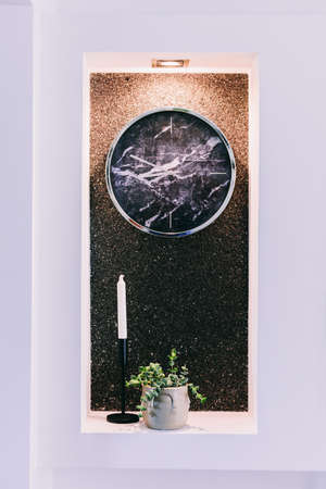 Niche in recessed wall in apartment with clock and decoration details. Home stagingの写真素材