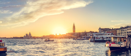 Venice, Italy panorama at sunset. View from canal to Campanile tower and Basilica Saluteの写真素材