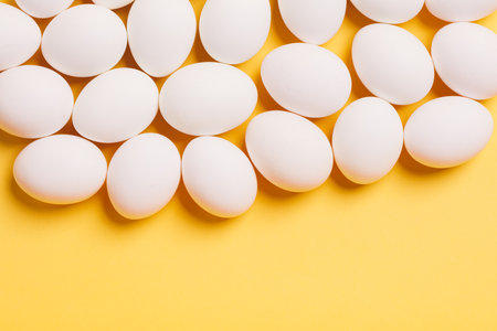 White eggs on yellow background. Easterの写真素材