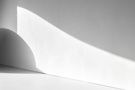 White wall with shadows and sunlight patterns and shapes.の素材