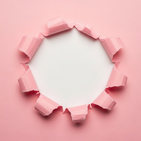 Pink paper hole punch with white backgroundの素材