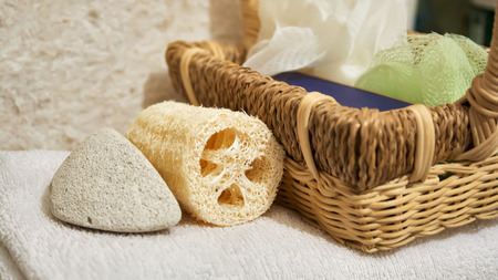 Beautiful view of spa accessories, basket and white towelの写真素材