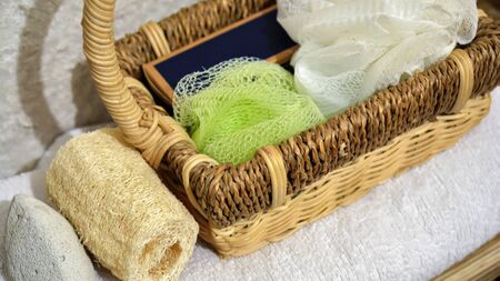 Beautiful view of spa accessories, basket and white towelの写真素材
