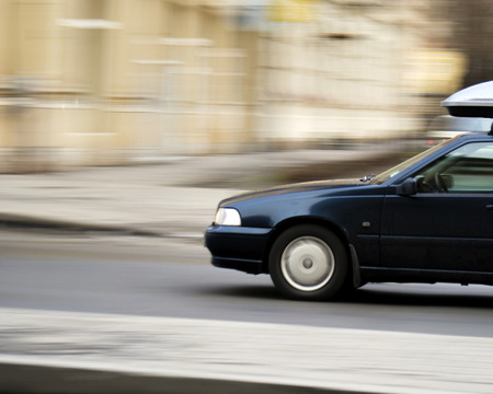 Beautiful view of the car fast riding on the roadの写真素材