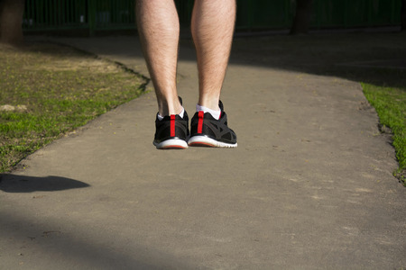 Man is jumping, strong legs, training outsideの写真素材