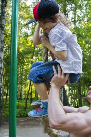 Beautiful view of a man catching a babyの写真素材