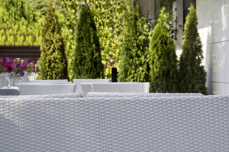 Beautiful white cafÃ © surrounded by trees and flowersの写真素材