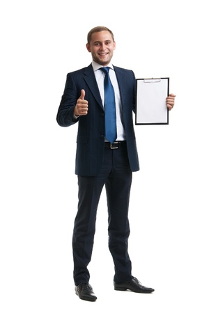 Young and successful businessman is holding a clipboardの写真素材