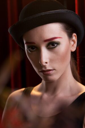 portrait of attractive female in bowler hatの写真素材