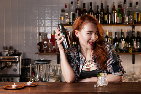 Sexy redhead bartenderの写真素材