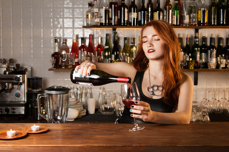 Sexy redhead bartenderの写真素材