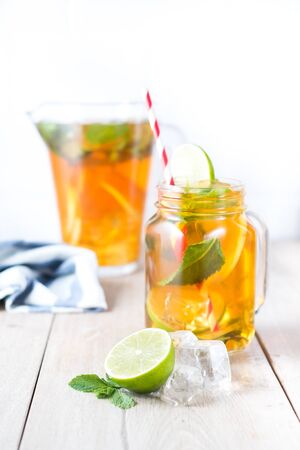 Cold tea with lime and mintの写真素材
