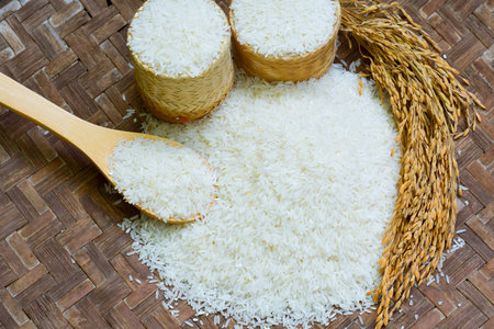 jasmine rice, Rice in Wooden Bowl, basmati rice, rice is on  wooden floor as the background.
