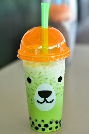 Cool green tea, plastic glassの写真素材