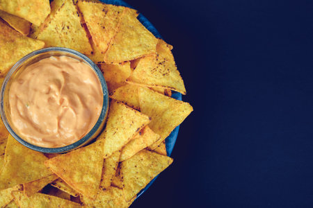 plate of nachos with dip