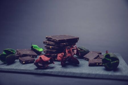 pieces of chocolate on stone plateの写真素材