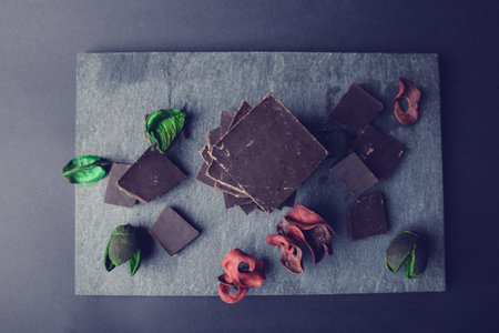 pieces of chocolate on stone plate