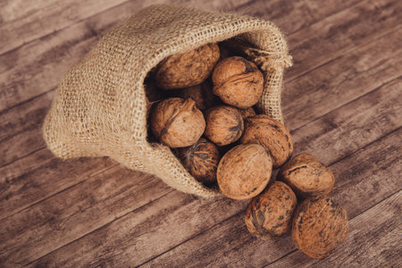 Whole nuts in a burlap sackの写真素材