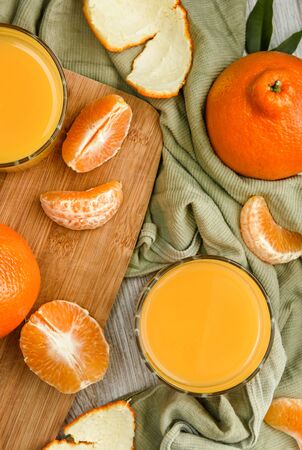Still life with juice and tangerines. Top view.の写真素材