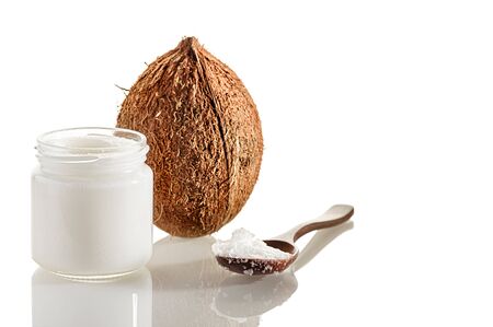 Composition with coconut, wooden spoon and jars of coconut butter. The concept of healthy food.の写真素材