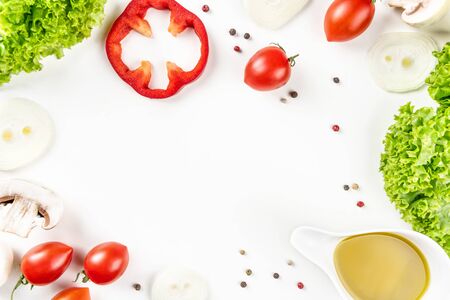 Vegetable still life. Lettuce, tomatoes, peppers, mushrooms, olive oil and spices. Top view.の写真素材