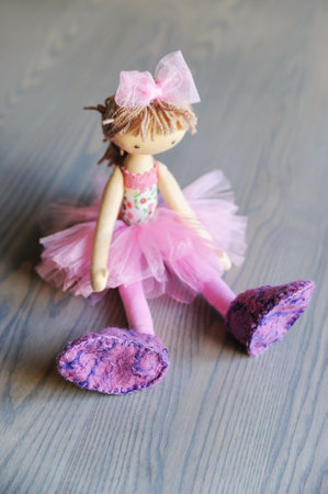 Cloth doll with felt baby booties.の写真素材