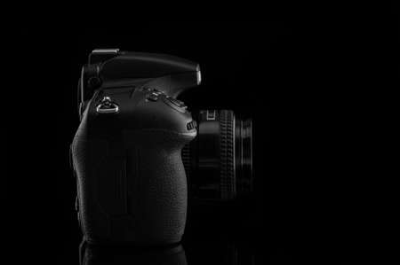 Camera with lens on black background.の写真素材