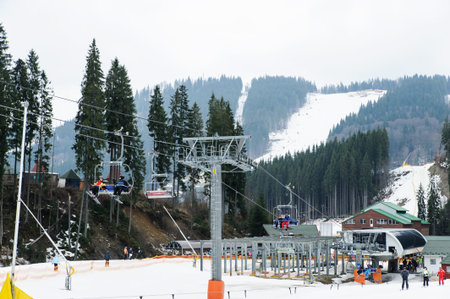 Ski Resort Bukovel. Carpathians. Ukraine- 03.10.2017. Skiers climb up the ski lift.