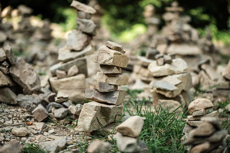 Garden of stones. Pyramids from rocks of brick breeds. Balance conceptの写真素材